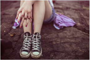 Sitting Teenage Girl with Converse Shoes